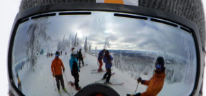 skiers reflected in goggles