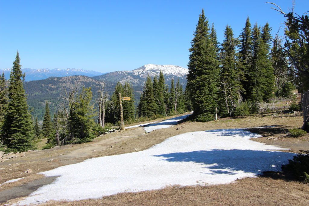 summit photo with snowbanks and Granite Mountain